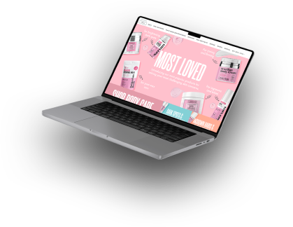 A sleek computer set against a vibrant pink background. The modern design of the computer contrasts beautifully with the lively pink hues of the webpage, creating a visually appealing and energetic atmosphere