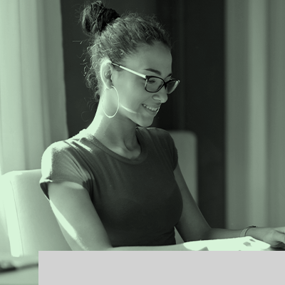 picture of a woman in a desk with a notebook
